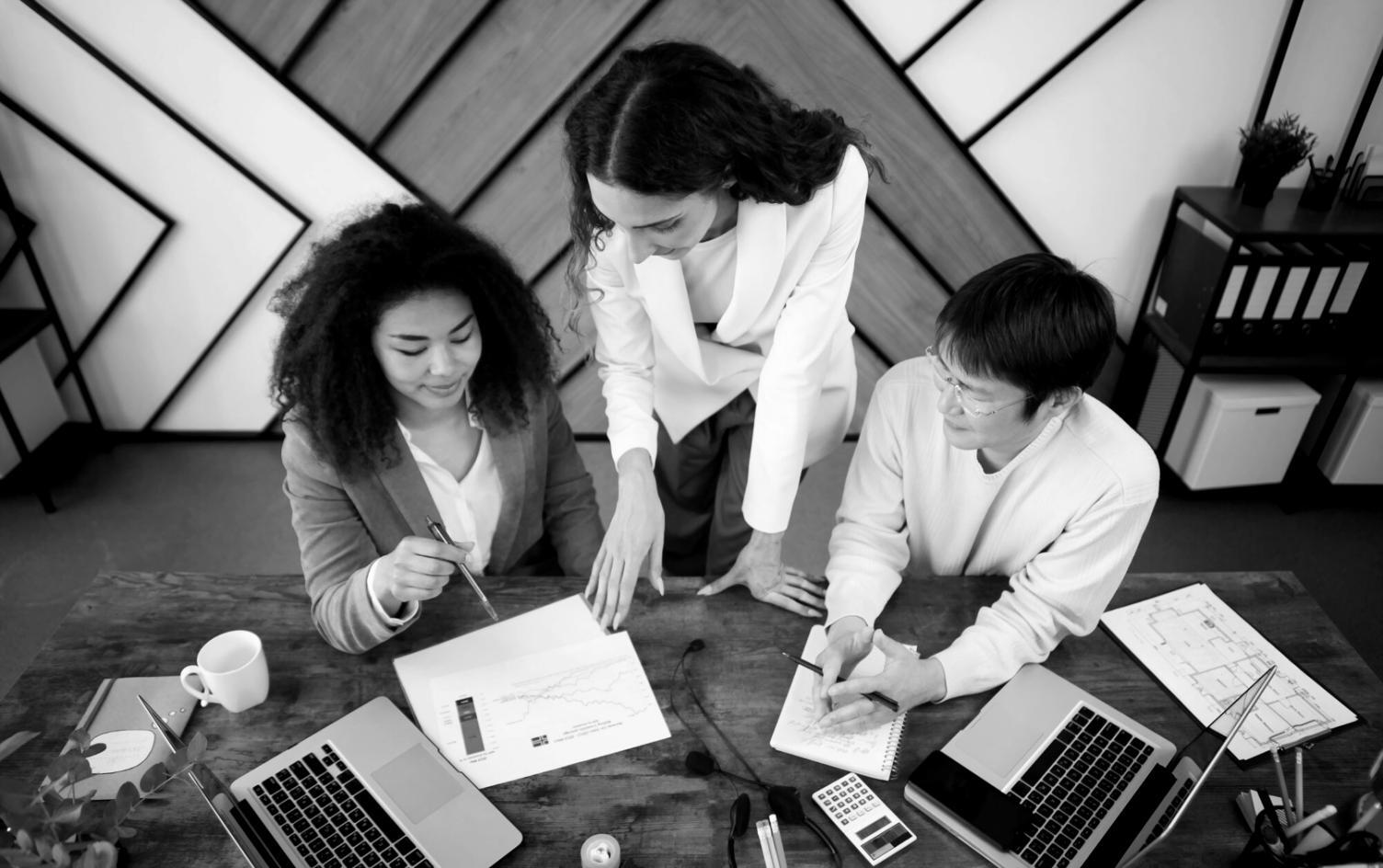 Student reviewing financial model output with instructor guidance